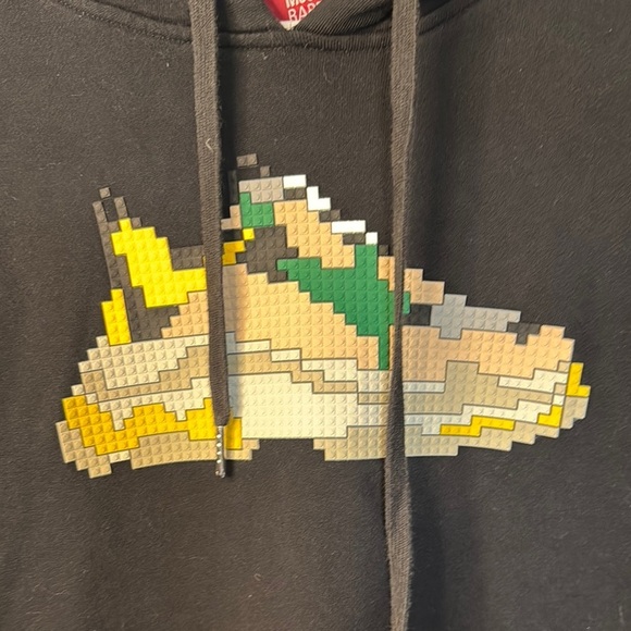 Mostly Heard Rarely Seen Black and Yellow Cartoon Graphic Sweater - Picture 3 of 14